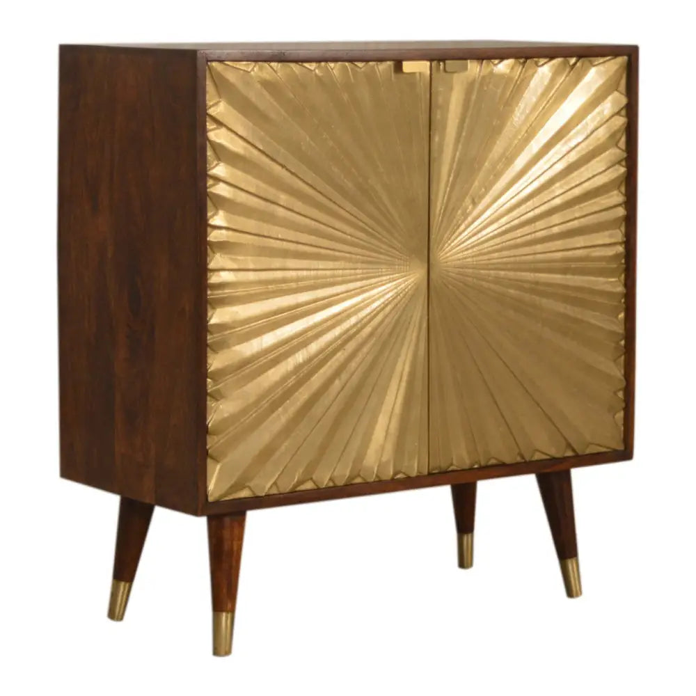 Dark wood manila gold cabinet with gold sunburst-patterned doors and brass accents on the legs