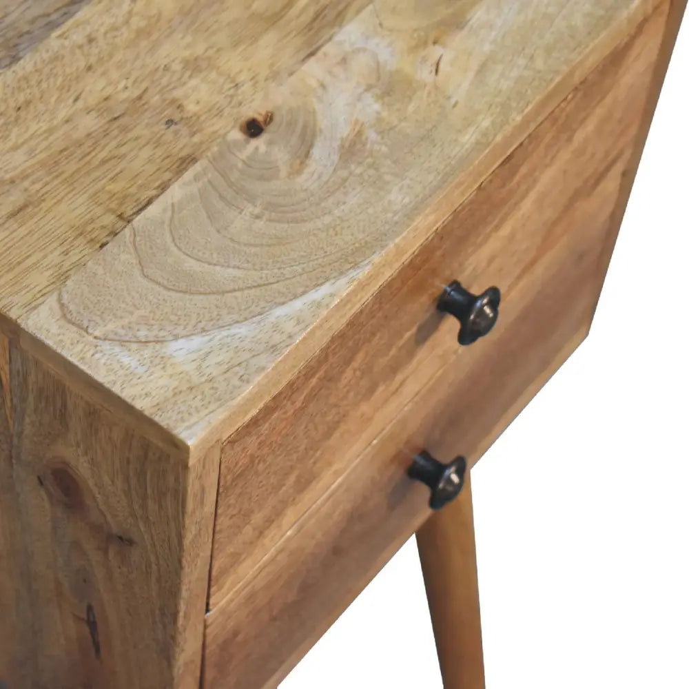 Rustic oak-ish bedside table features two drawers with dark metal knobs perfect for opulent furniture setups