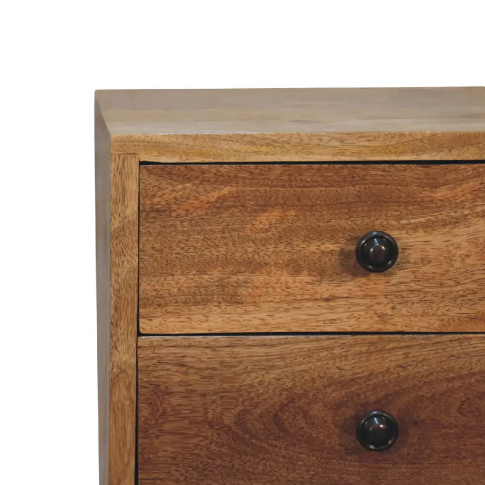 Rustic wooden bedside table featuring two drawers with sleek black round knobs in opulent oak finish