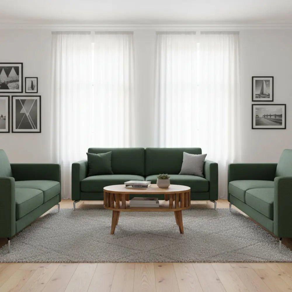 Dark green upholstered sofa with matching armchairs around a wooden mini ariella coffee table set up for living room use