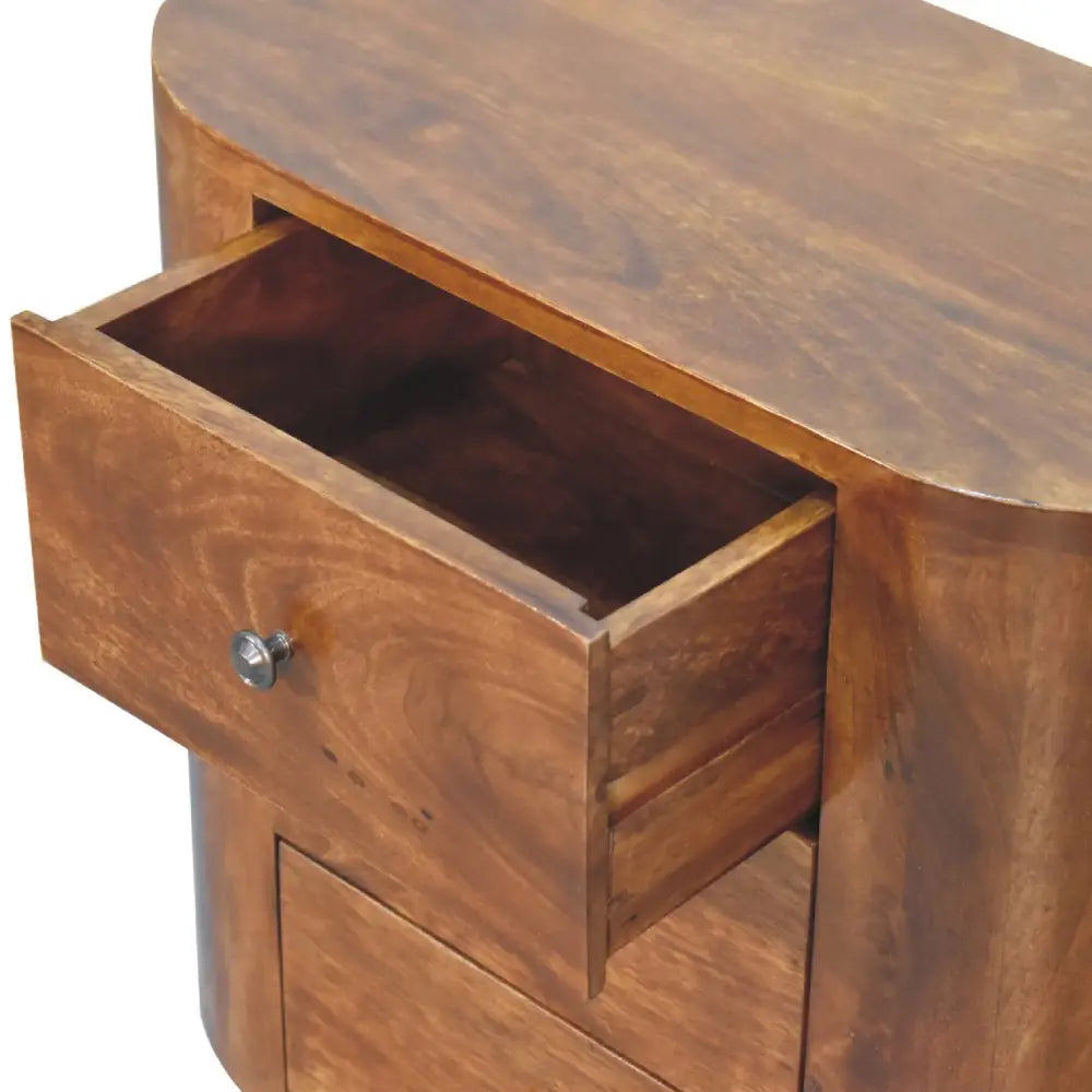 A warm medium brown wooden mini chestnut cabinet with a curved top and silver knob drawer for bedroom use