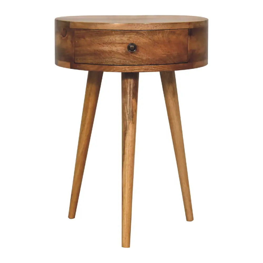 Mini oak circular bedside table with single drawer and three tapered legs perfect as a compact bedside option