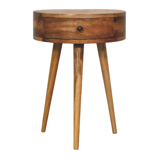 Mini oak circular bedside table with single drawer and three tapered legs perfect as a compact bedside option