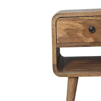 A mid-century modern wooden mini oak-ish curve lower bedside with a single drawer and black round knob