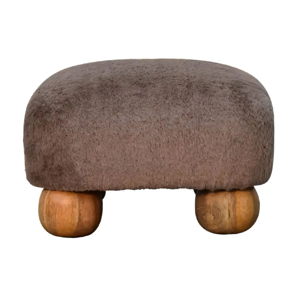 Mocha faux fur nordic footstool with brown faux fur upholstery and rounded wooden legs for cozy seating