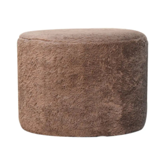 A plush mocha faux fur round footstool with a soft textured surface perfect as a cozy ottoman or footrest