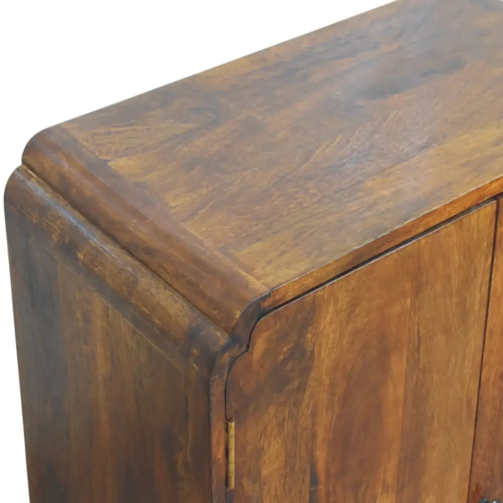Newton chestnut cabinet in rich warm tones made from solid mango wood with smooth polished finish and visible grain patterns