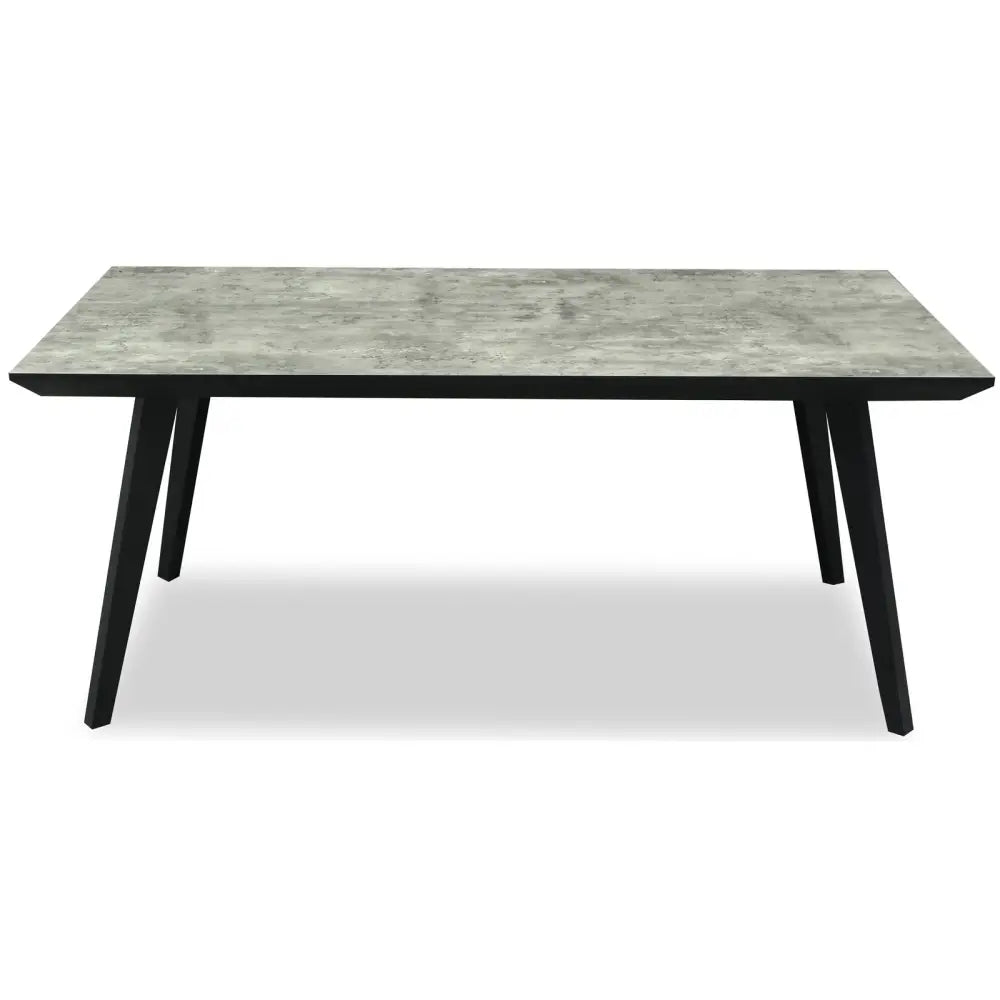 Modern nivara rectangular dining table with gray concrete top and sleek black tapered legs for stylish dining