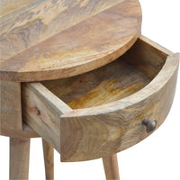 Nordic circular bedside table made of light brown wood with visible grain patterns perfect for a cozy bedroom setup