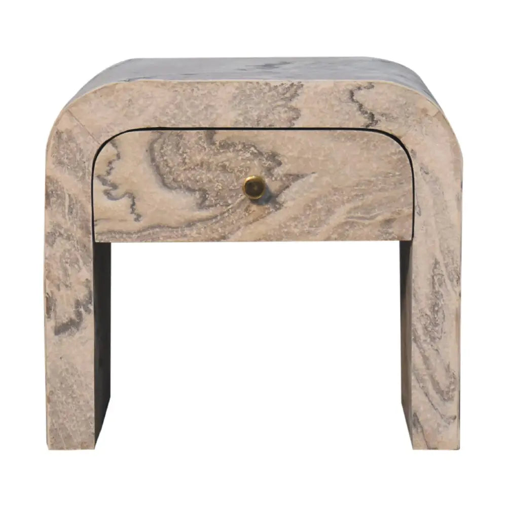 Nouveau bedside nightstand with a curved design in beige marble featuring gray veins and a brass drawer knob for opulent furniture