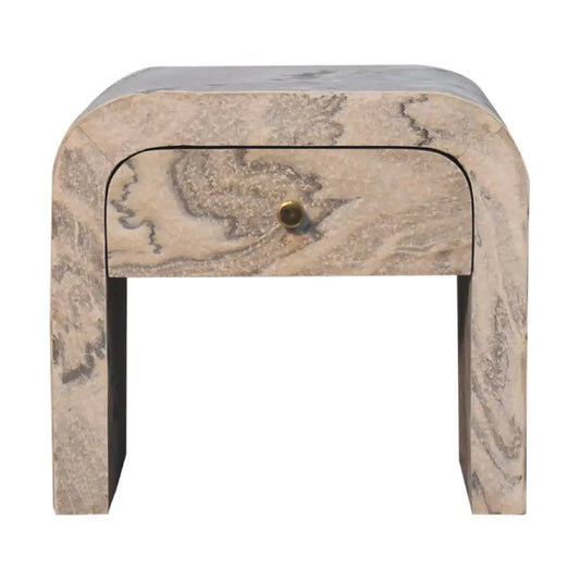 Nouveau bedside nightstand with a curved design in beige marble featuring gray veins and a brass drawer knob for opulent furniture