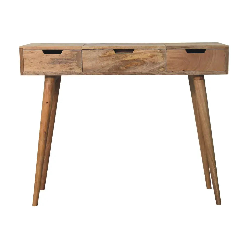 Light brown oak-ish dressing table with three drawers and tapered legs in opulent furniture style