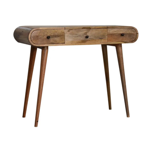 A mid-century modern oak-ish round dressing table with natural wood finish, three drawers, and tapered legs