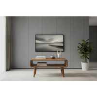 Black-framed flat-screen tv mounted on gray wall showcasing open oak-ish media unit features and sleek design