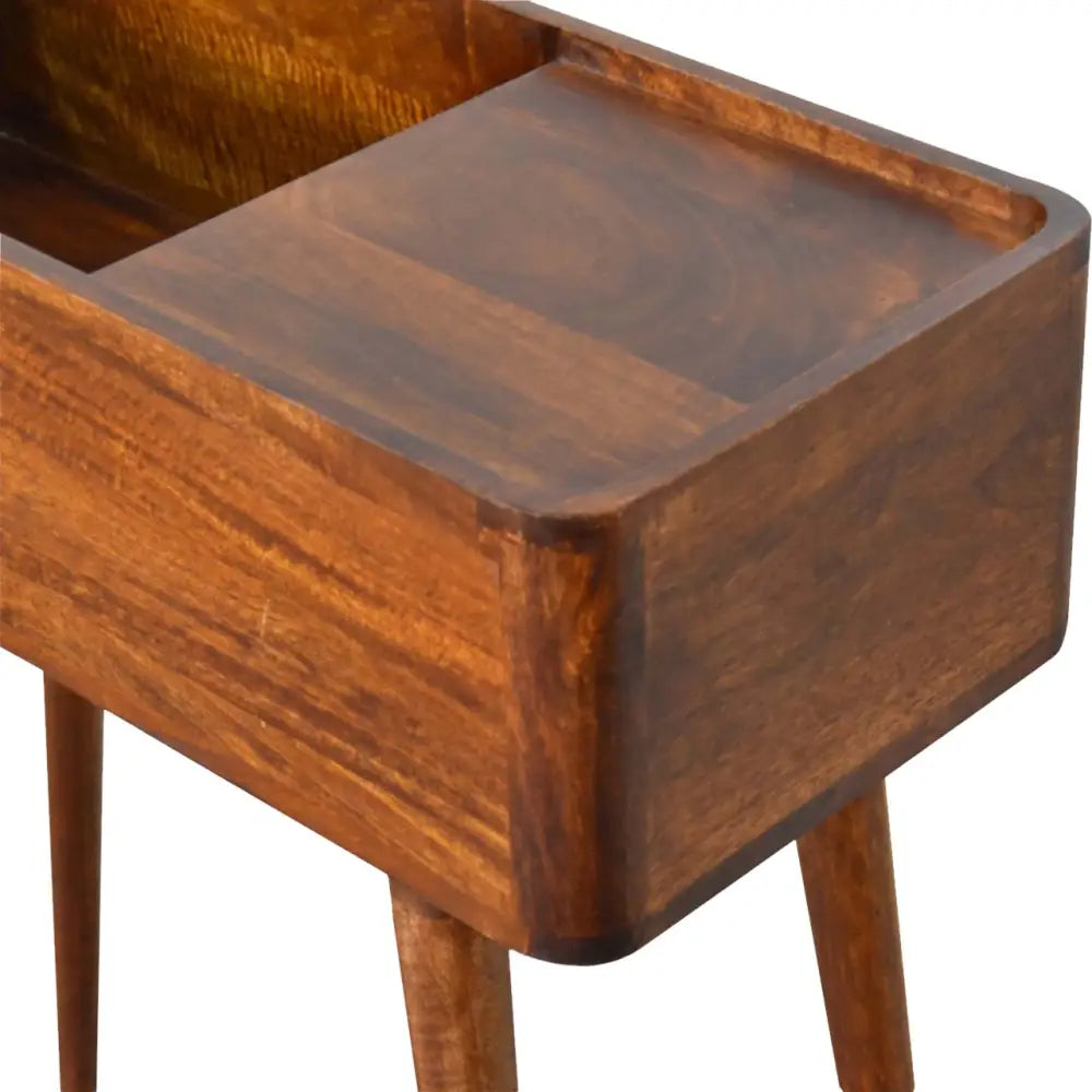 A chestnut console table with a warm dark brown wood finish and smooth polished top with tapered legs