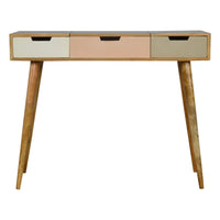 A mid-century modern pink gradient dressing table with three drawers in cream blush pink and sage green finishes
