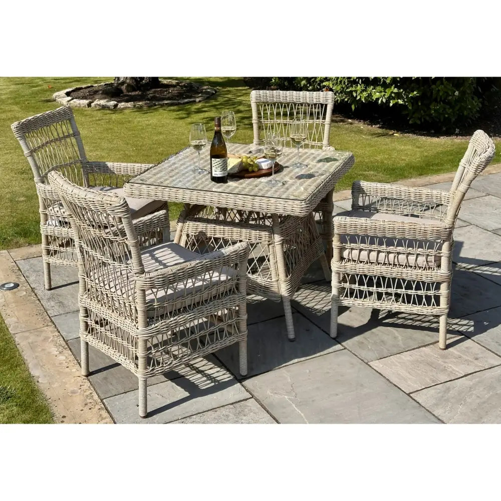 Beige wicker provence collection outdoor 4 seater dining set with square table and cushioned seats
