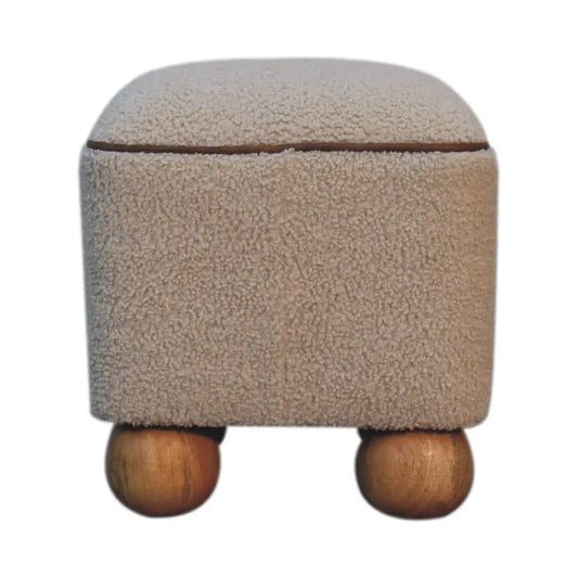 Beige fuzzy serenity footstool with rounded wooden ball feet perfect for cozy storage and extra comfort