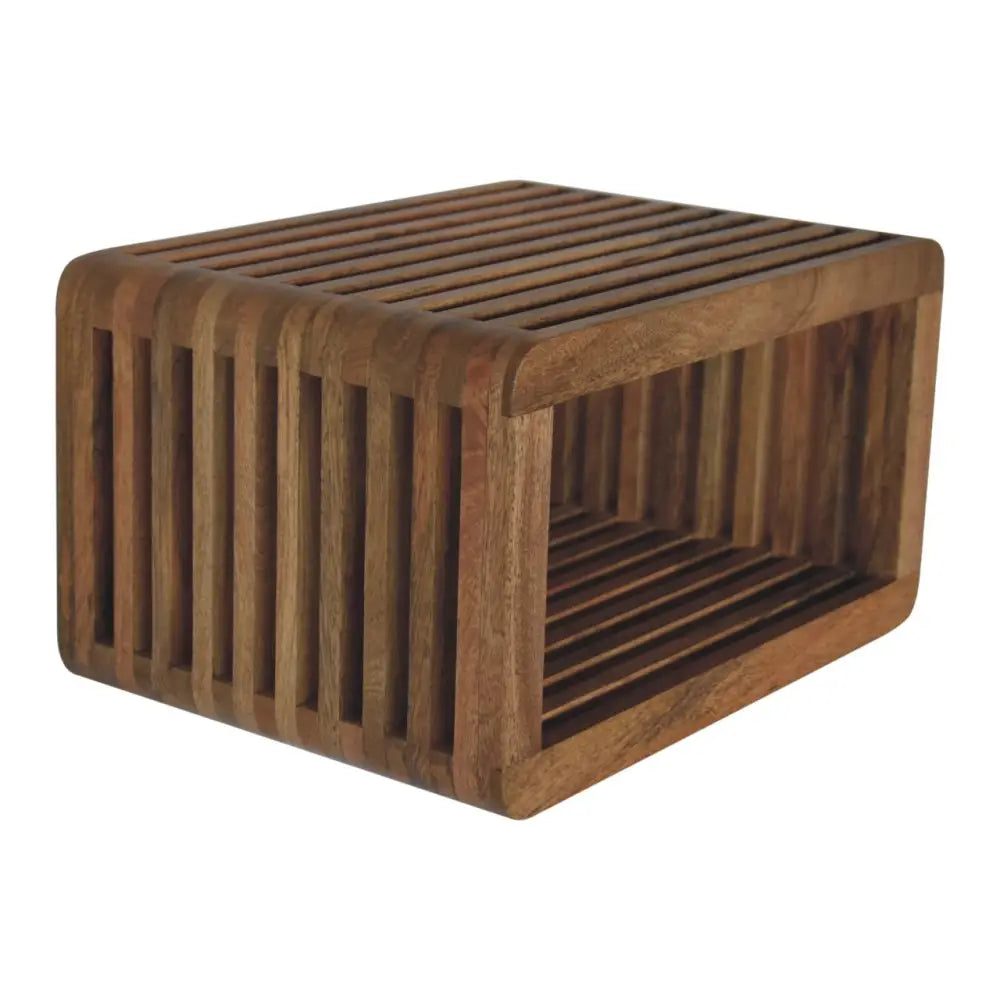 A dark brown teak wood rectangular wall mounted bedside with slatted top and sides for compact bedroom use