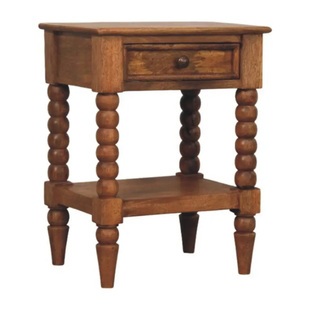 Rustic spindle bedside table in warm brown solid mango wood with single drawer and spindle legs