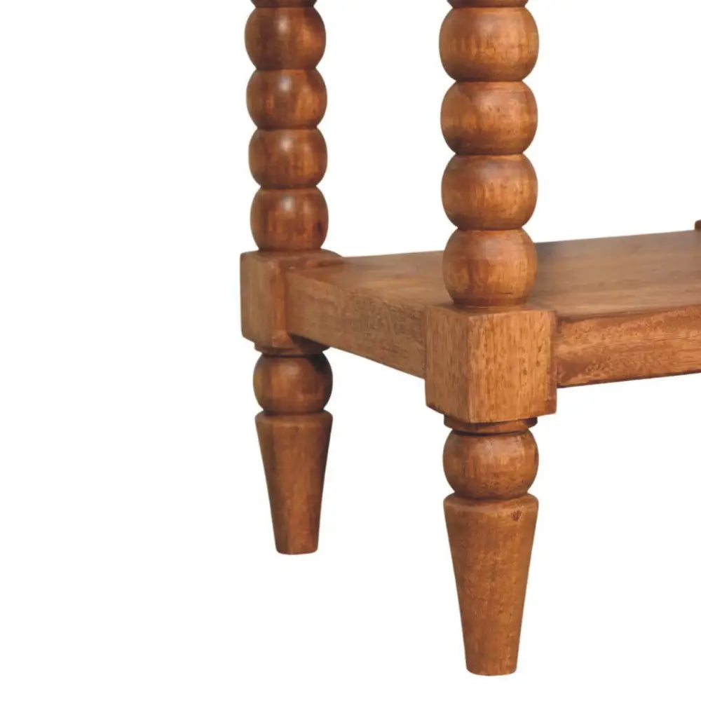Rustic spindle bedside table with turned wooden spindles and warm natural finish perfect as a bedside table
