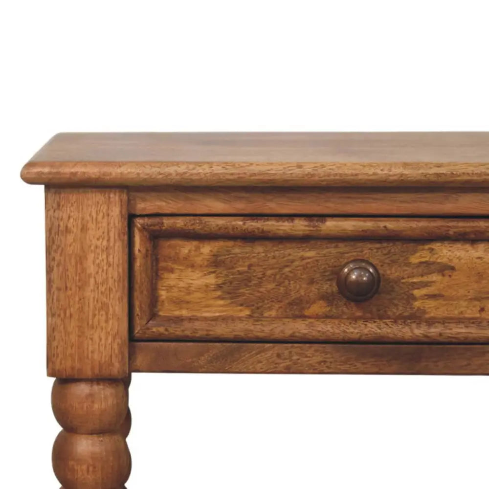 Rustic wooden spindle bedside table with turned spindles and warm medium brown finish for your bedside setup