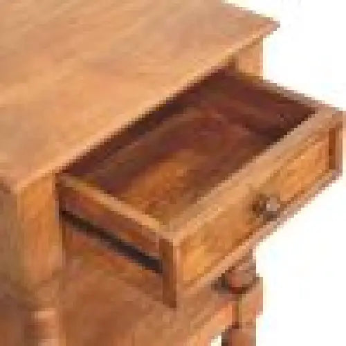Brown leather wallet with multiple compartments and zipper closure shown with spindle bedside table nearby