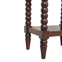 Dark brown spindle winewood bedside table with turned spindles and a lower shelf for storage