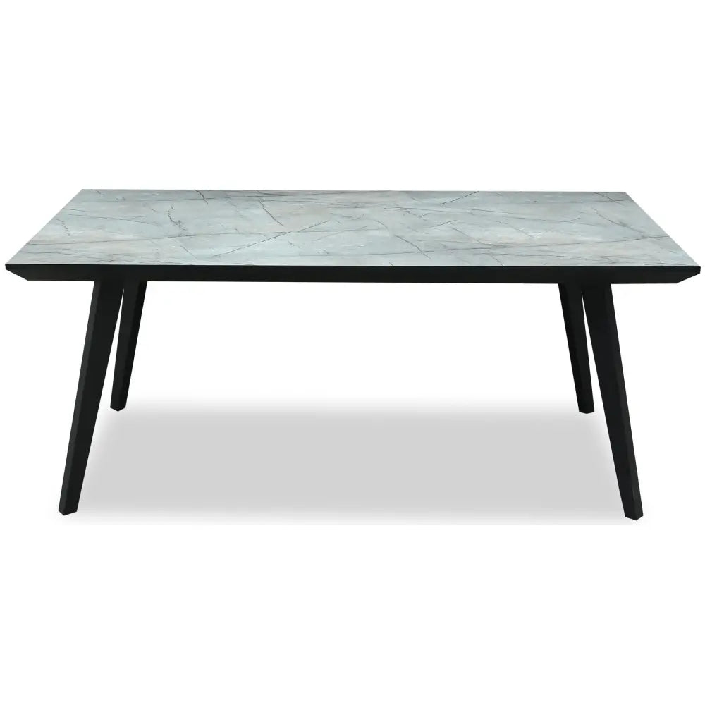 Stellen rectangular dining table with a light gray marble top and sleek black tapered legs for modern dining