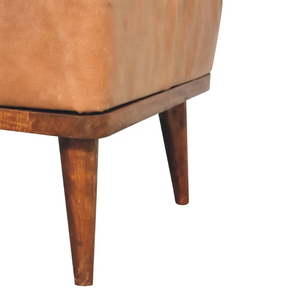 Tan leather armchair with wooden frame and tapered legs made from durable tan buffalo leather for stylish seating
