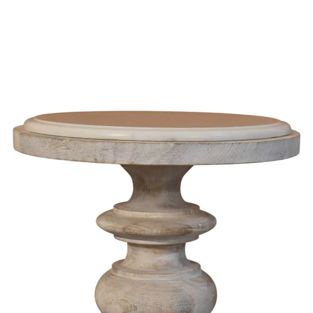The bellis marble accent table is a rustic white-washed solid mango wood accent table with a round light brown top and carved base