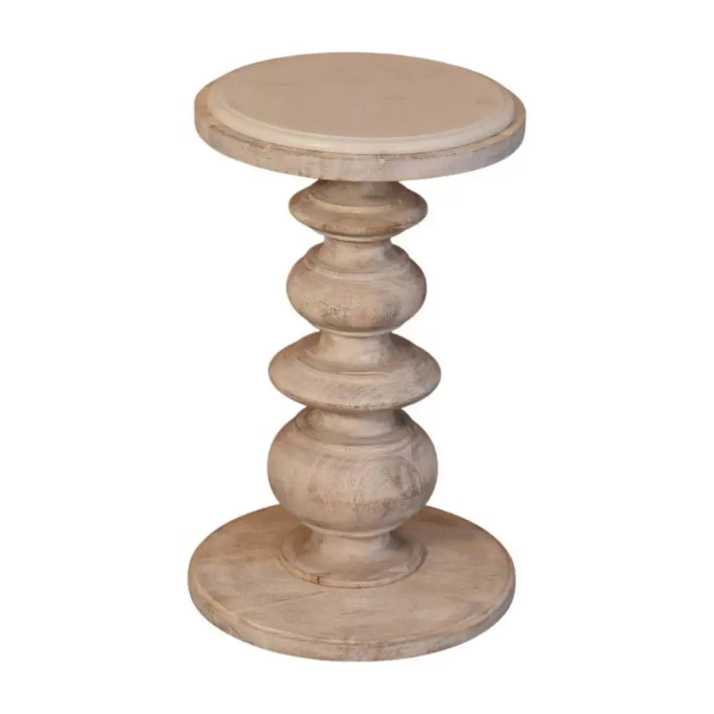 The bellis marble accent table is a rustic off-white solid mango wood accent table with a round top and stacked legs