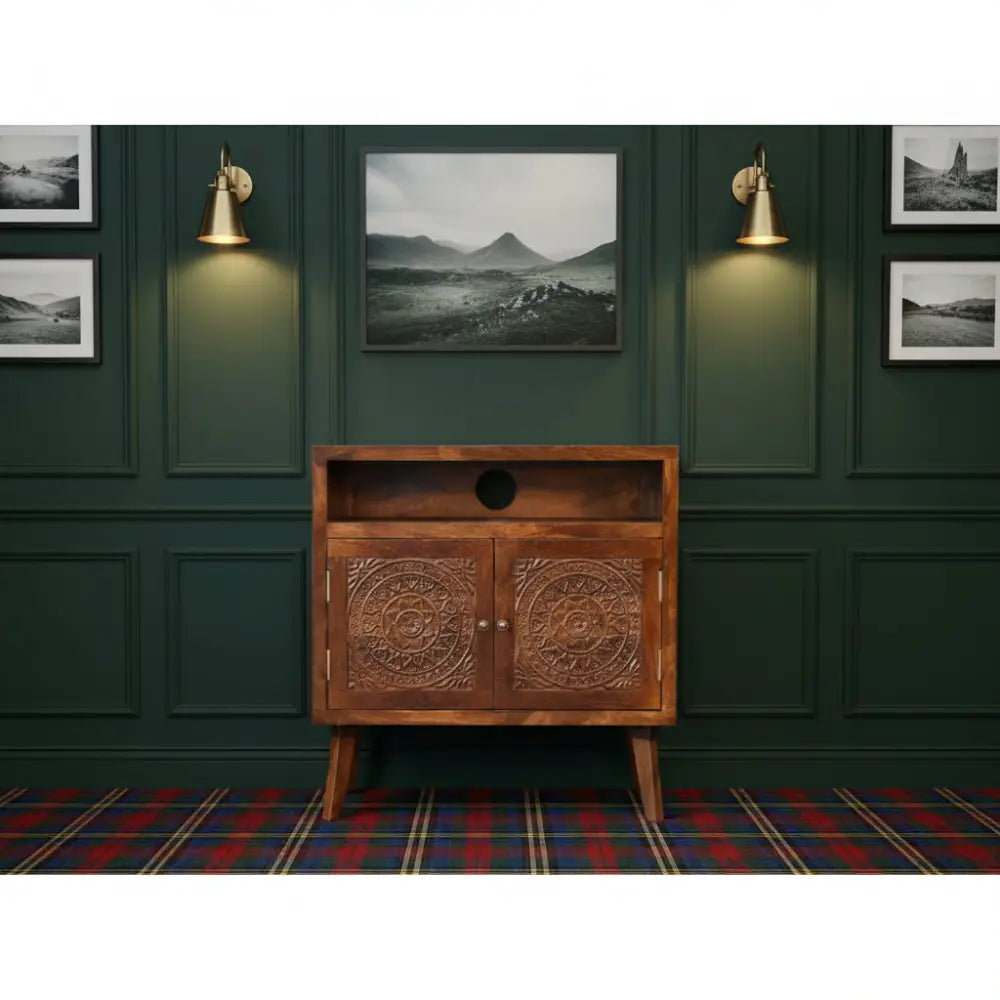 Brown wooden tova open shelf cabinet with intricate circular carvings and round cutout on open shelf doors