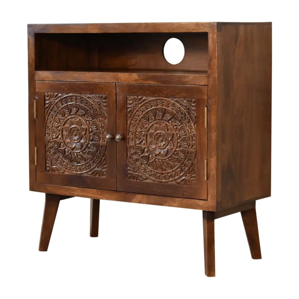 Dark brown wooden tova open shelf cabinet with carved mandala doors and circular cutout on the upper open shelf