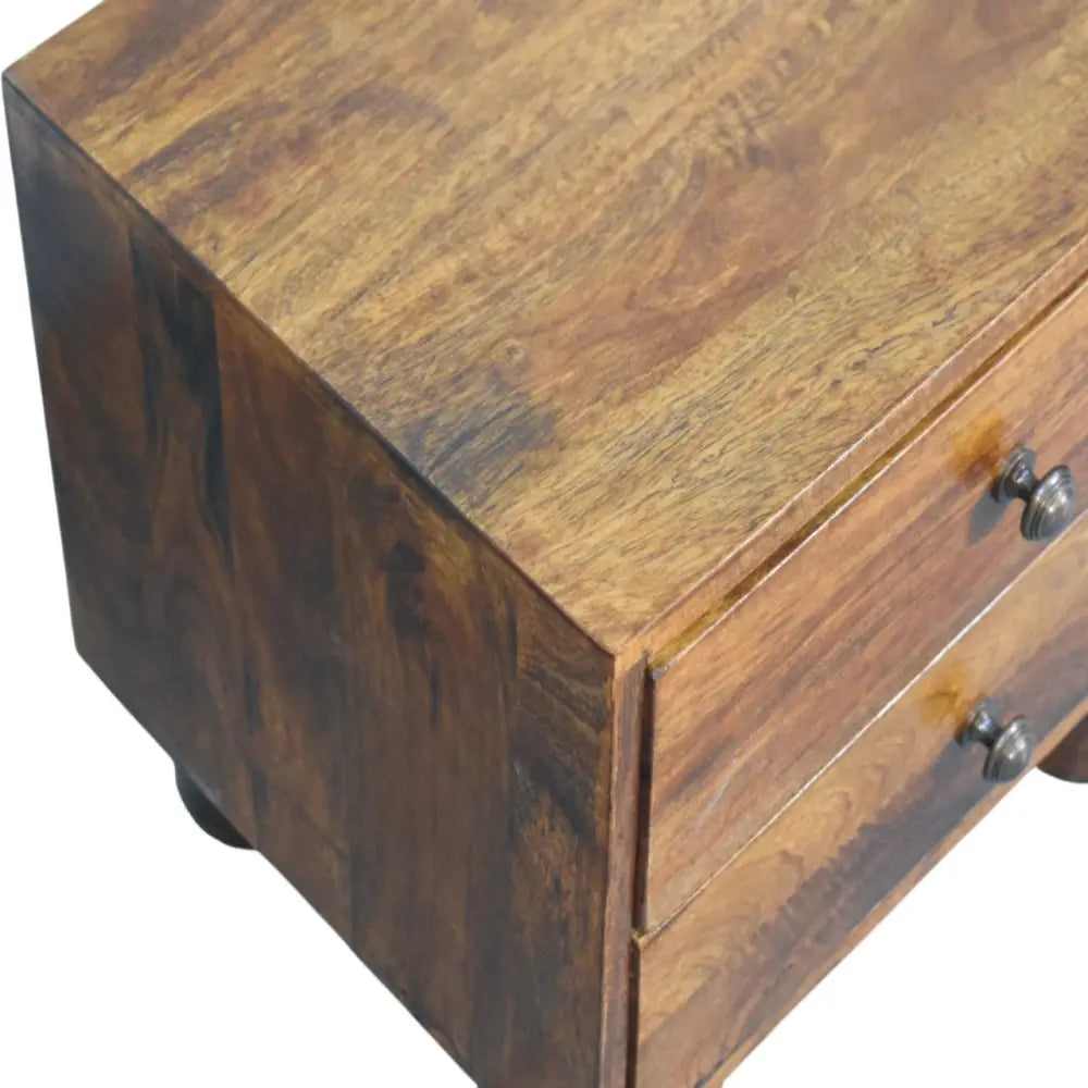 Tula 2 drawer chestnut nightstand with solid mango wood, warm brown finish, and dark metal knobs is a rustic wooden side table