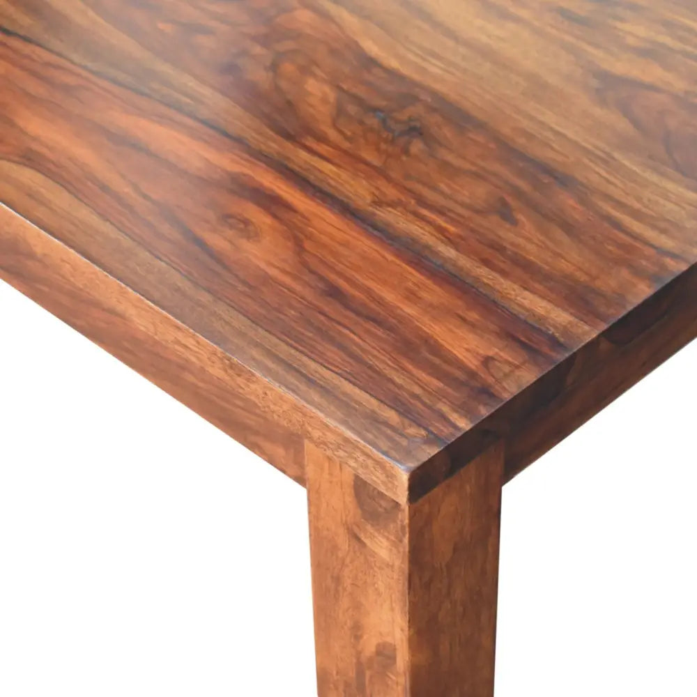 Rich dark brown wooden tula dining table with smooth polished surface and natural grain patterns