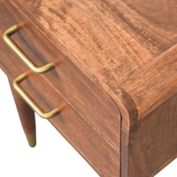 Valenza two-drawer bedside table in warm solid mango wood with sleek brass handles and tapered legs