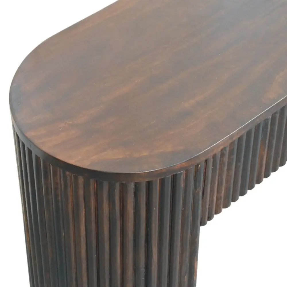 Dark brown wooden console table with smooth oval top and vertical fluted legs matching velvet mocha fluted bench style