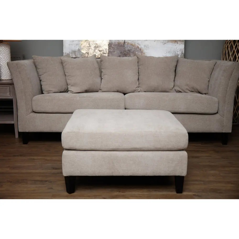 Beige upholstered vesper taupe ottoman foot stool with textured fabric and dark wooden legs matching sectional sofa