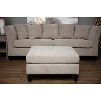 Beige upholstered vesper taupe ottoman foot stool with textured fabric and dark wooden legs matching sectional sofa