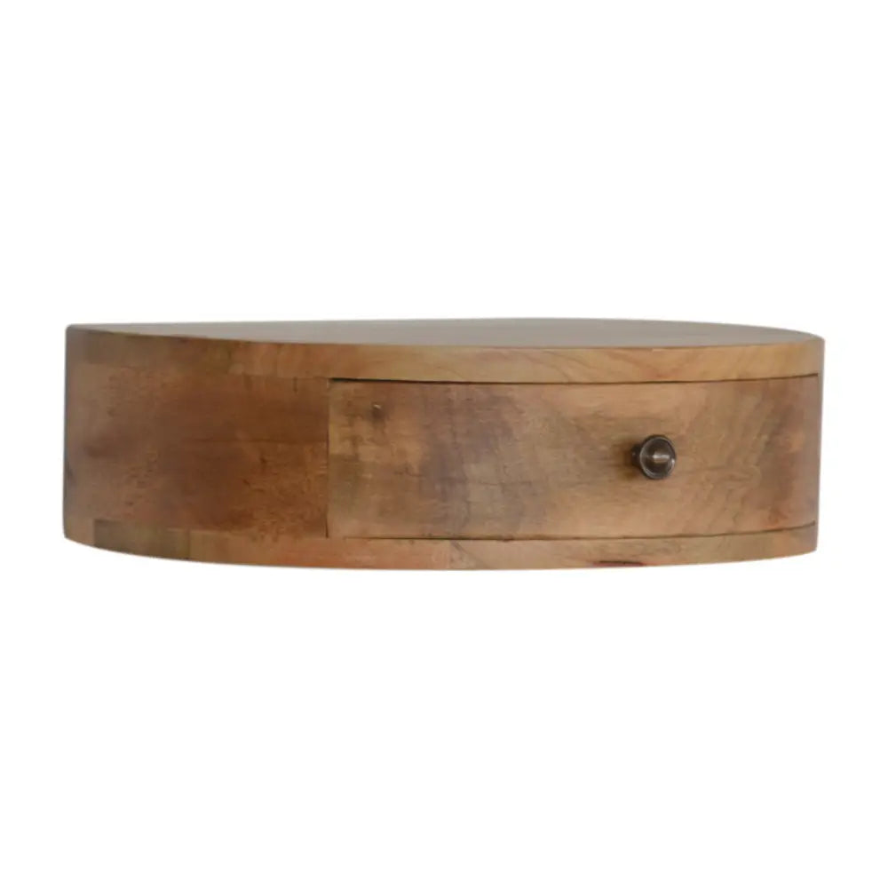 Light brown wooden wall mounted rounded bedside shelf with single drawer and metal knob for compact storage