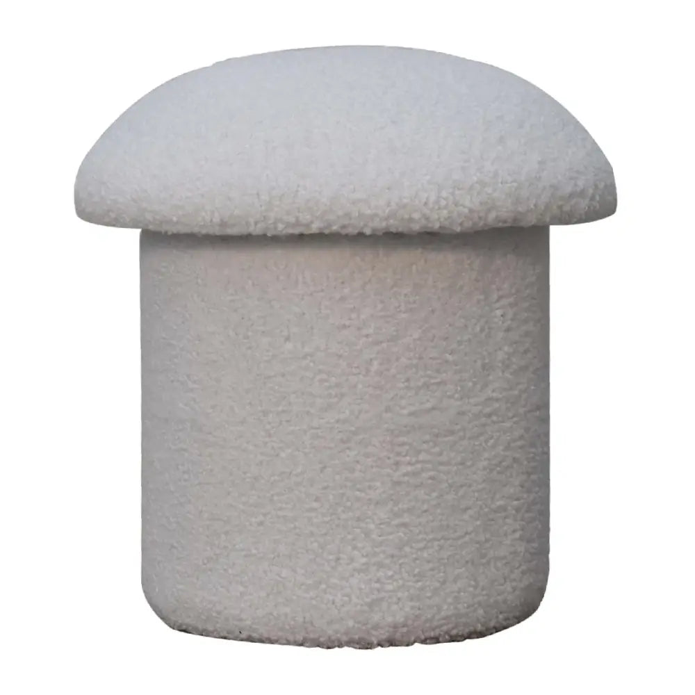 A plush white boucle mushroom footstool with soft textured fabric in an off-white color perfect for lounging