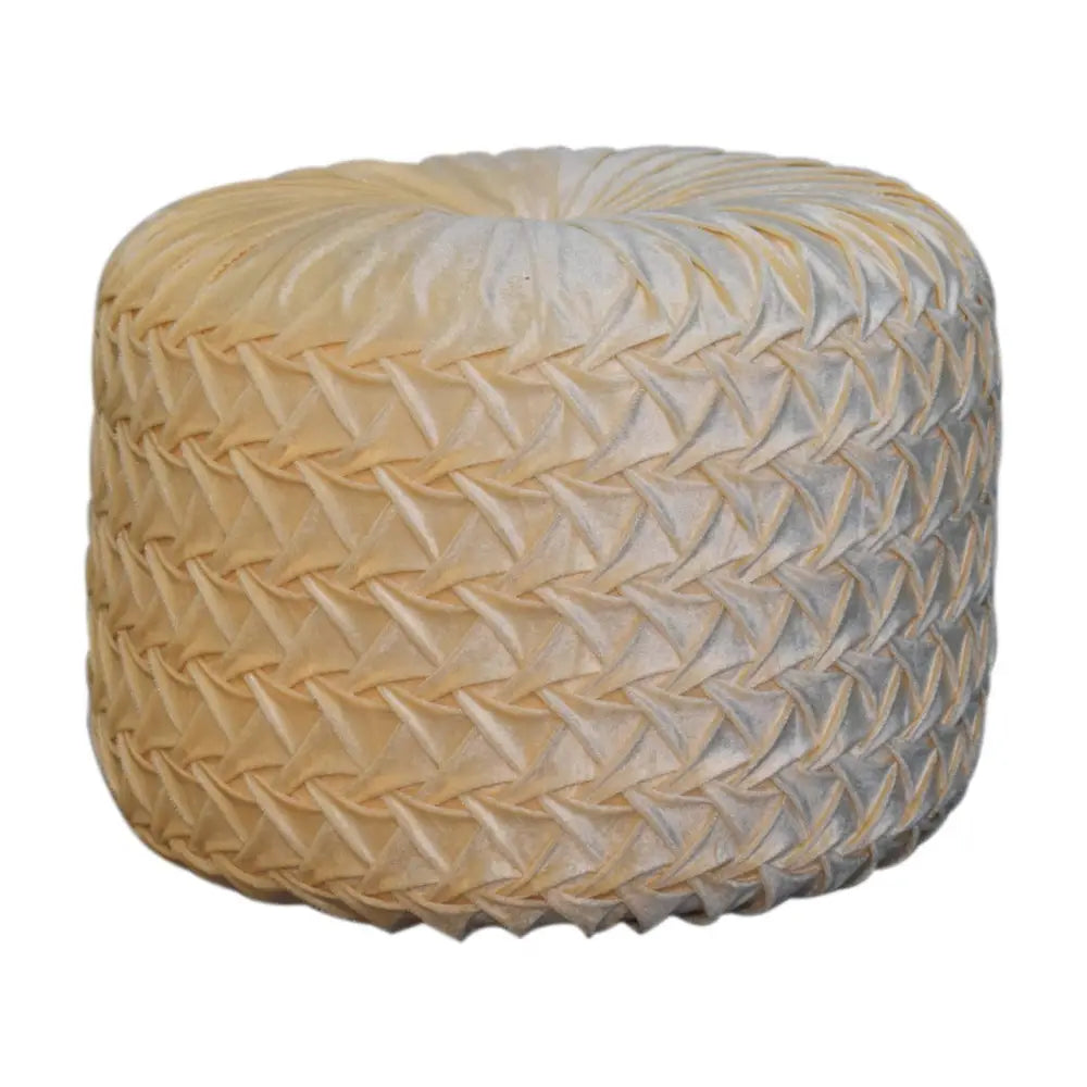 Cream-colored woven white hart pouffe with textured interlaced pattern perfect as a cozy footrest or seat