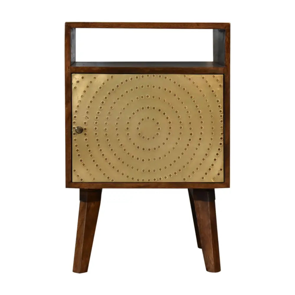 A mid-century modern zen bedside with dark wood frame and gold metal door featuring concentric rivet patterns
