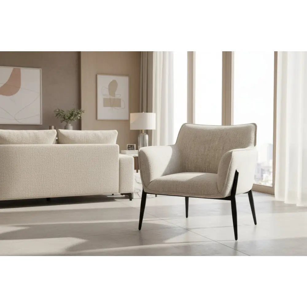 Beige textured fabric zephra chair with sleek black metal legs and a softly contoured silhouette for comfy seating
