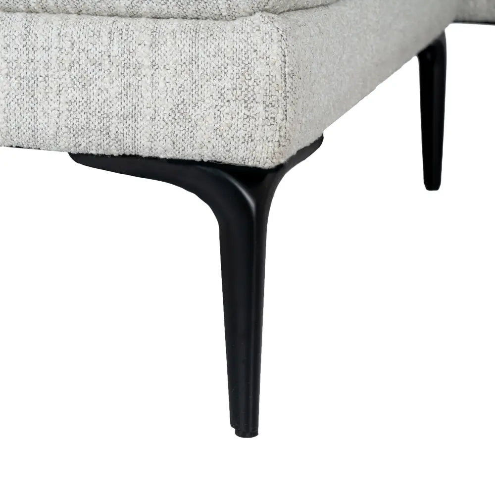 Zephra three seater sofa with footstool featuring a modern gray textured fabric armchair with black metal legs
